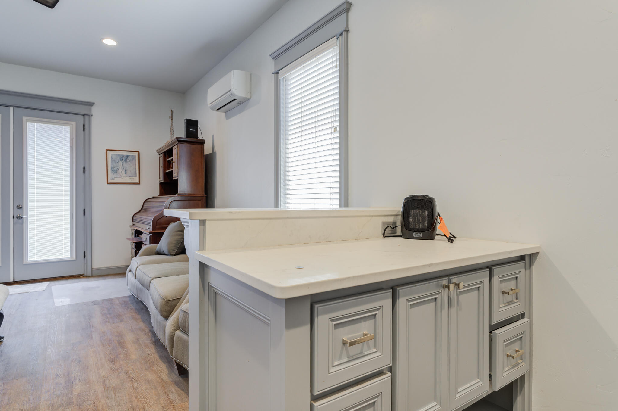 8917 County Road 6870 Lubbock, TX 79407 - Photo 50 of 53 a room with a sink dishwasher and white cabinet with wooden floor