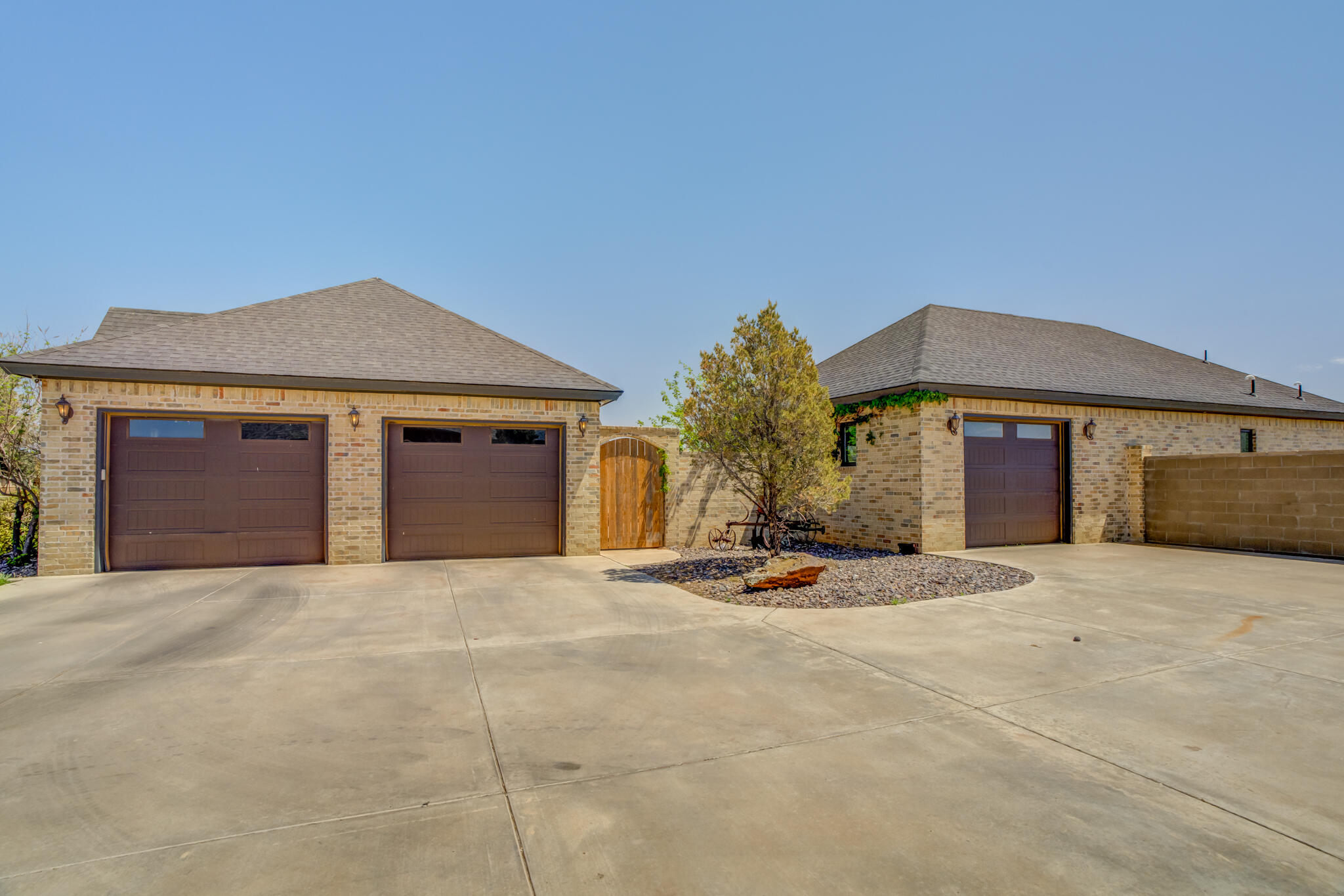 8917 County Road 6870 Lubbock, TX 79407 - Photo 53 of 53 a front view of a house with a yard and garage