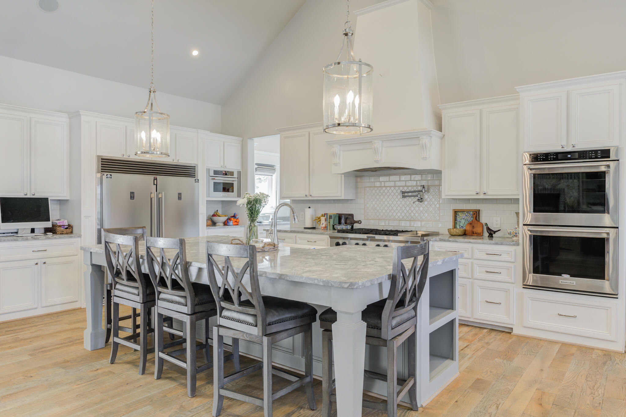 8917 County Road 6870 Lubbock, TX 79407 - Photo 6 of 53 a kitchen with stainless steel appliances a table chairs stove and refrigerator