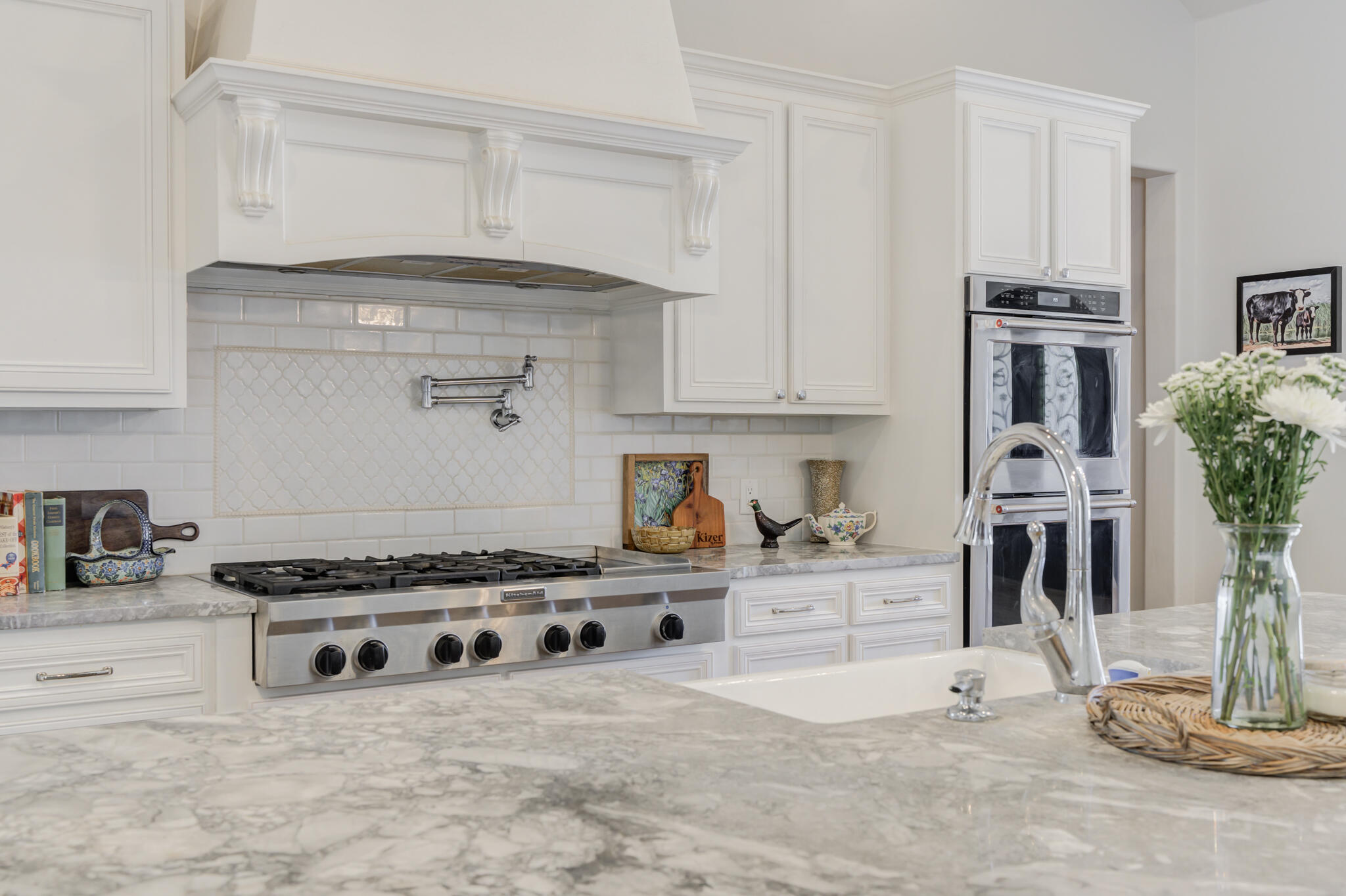 8917 County Road 6870 Lubbock, TX 79407 - Photo 9 of 53 a kitchen with stainless steel appliances granite countertop a stove and a white cabinets