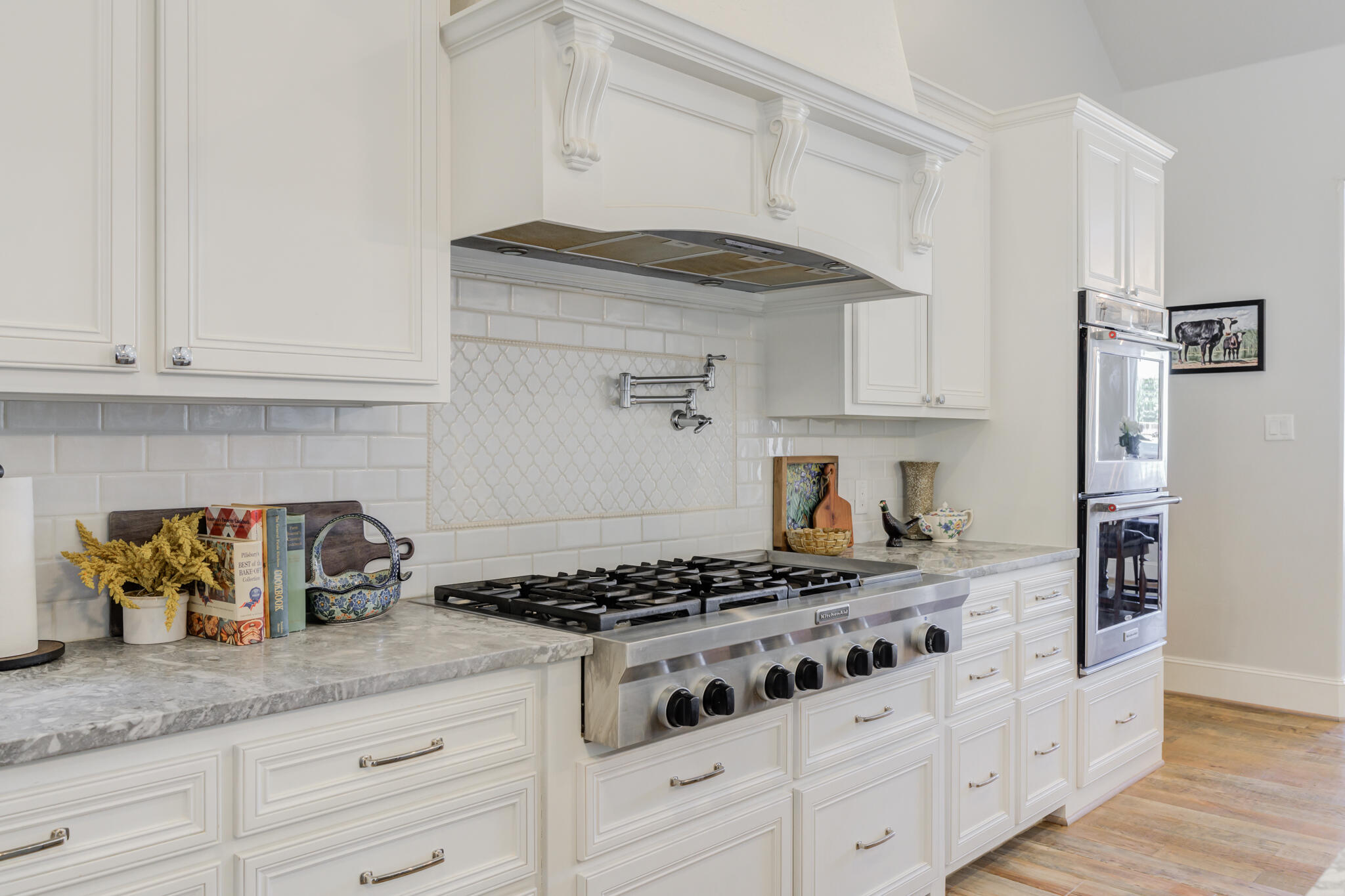 8917 County Road 6870 Lubbock, TX 79407 - Photo 10 of 53 a kitchen with granite countertop a sink stove and cabinets