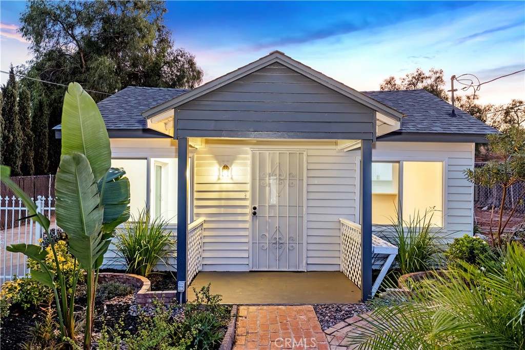 6860 Gaylord Street Riverside, CA 92505 - Photo 1 of 1 a view of a house with a small yard