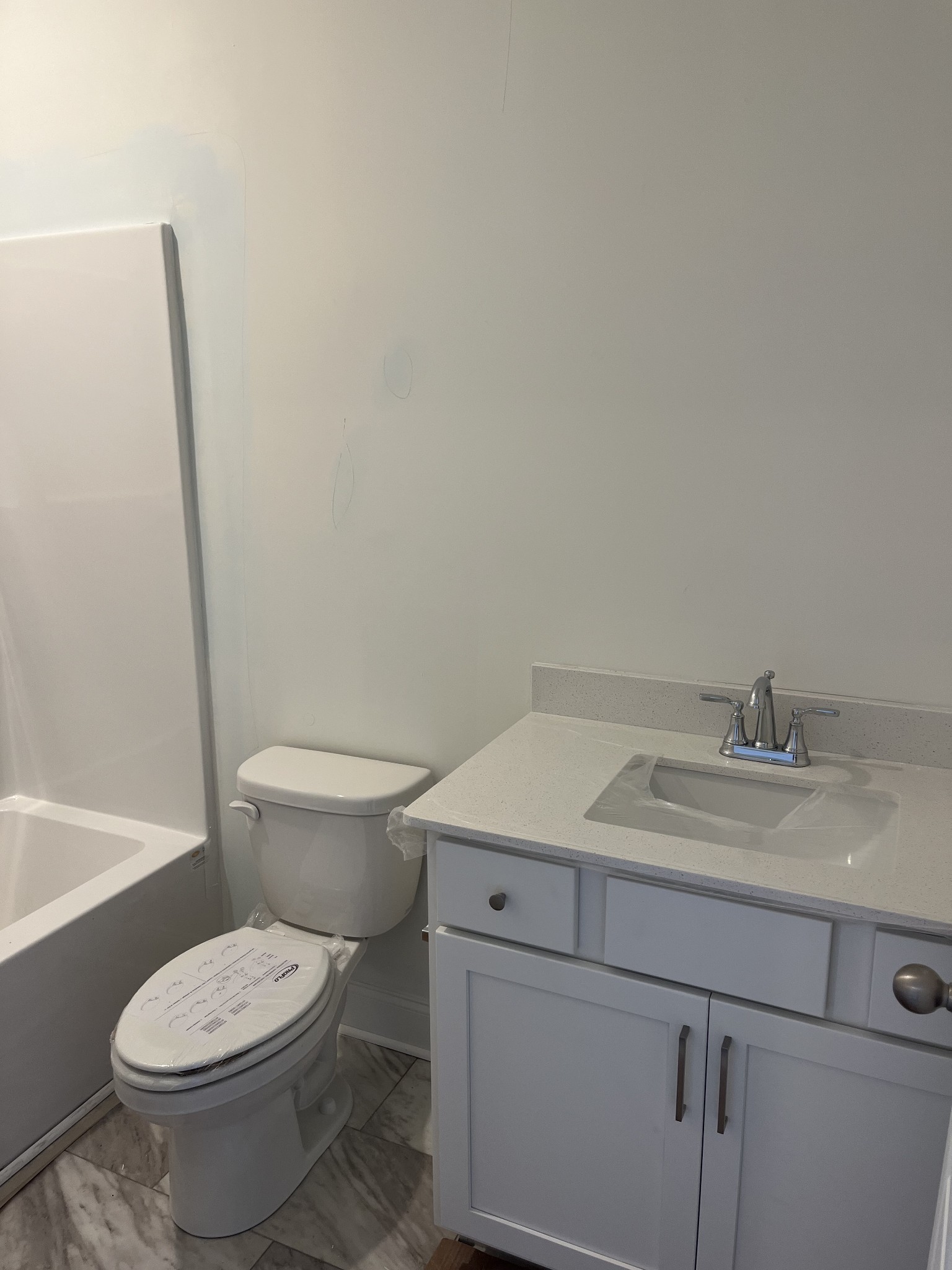 3123 Arbor Valley Rd Spring Hill Spring Hill, TN 37174 - Photo 6 of 13 a bathroom with a granite countertop toilet and a sink