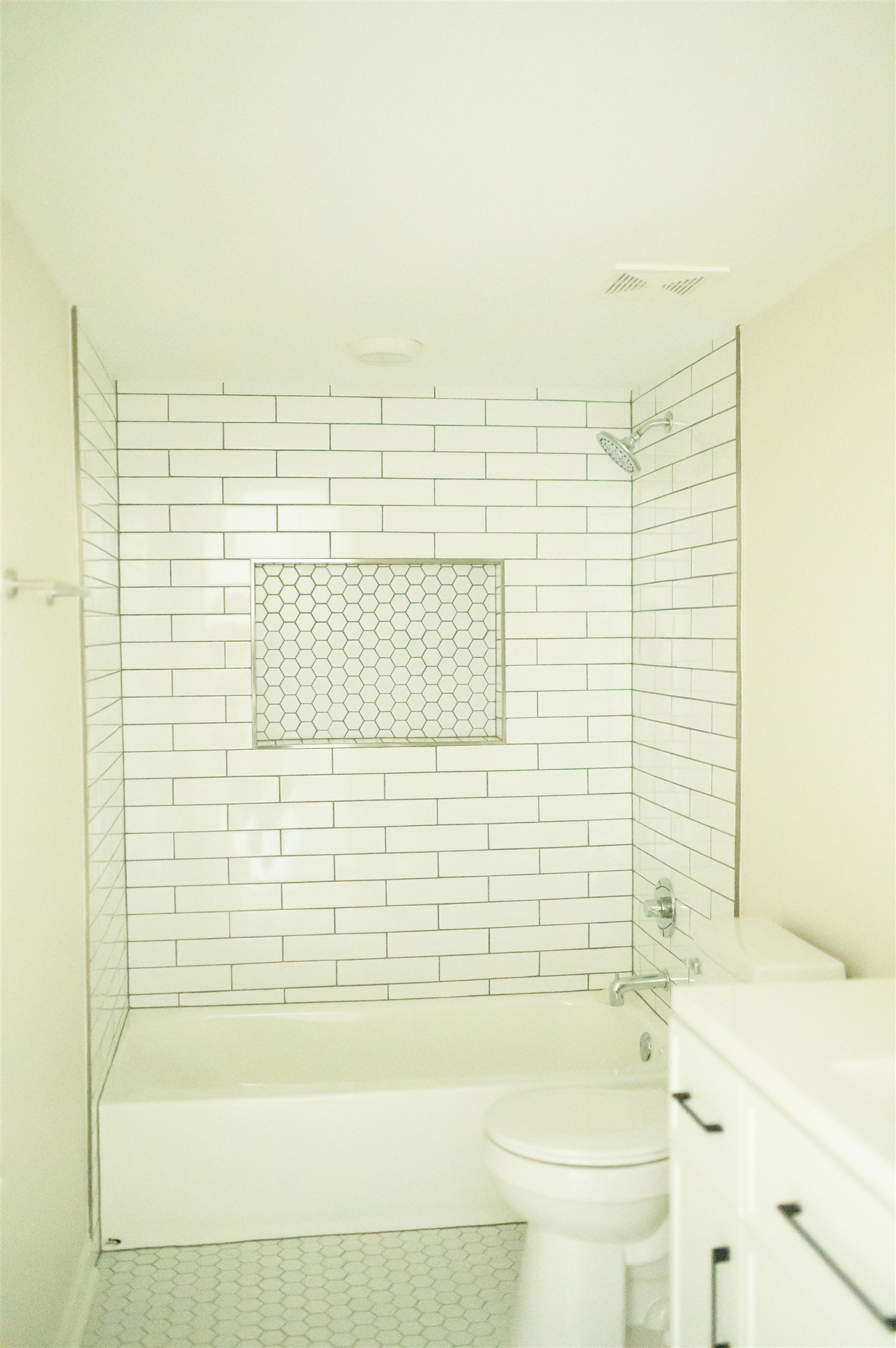 a bathroom with a bathtub and shower