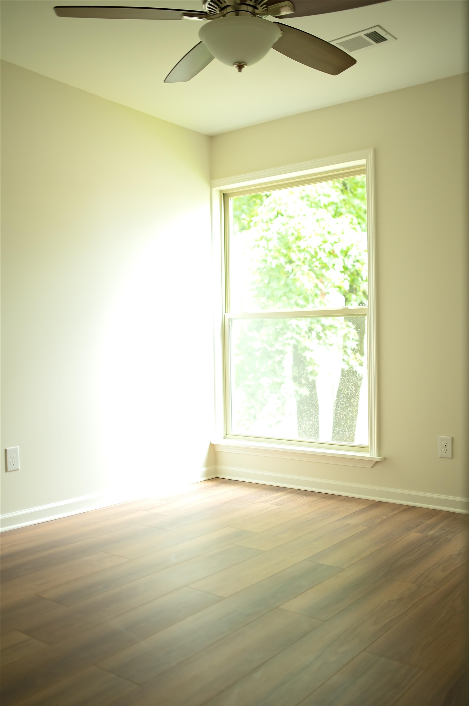 3102 Rising Sun Road, Unit 59 Lakeland, TN 38002 - Photo 26 of 27 Spare room featuring ceiling fan and hardwood / wood-style flooring