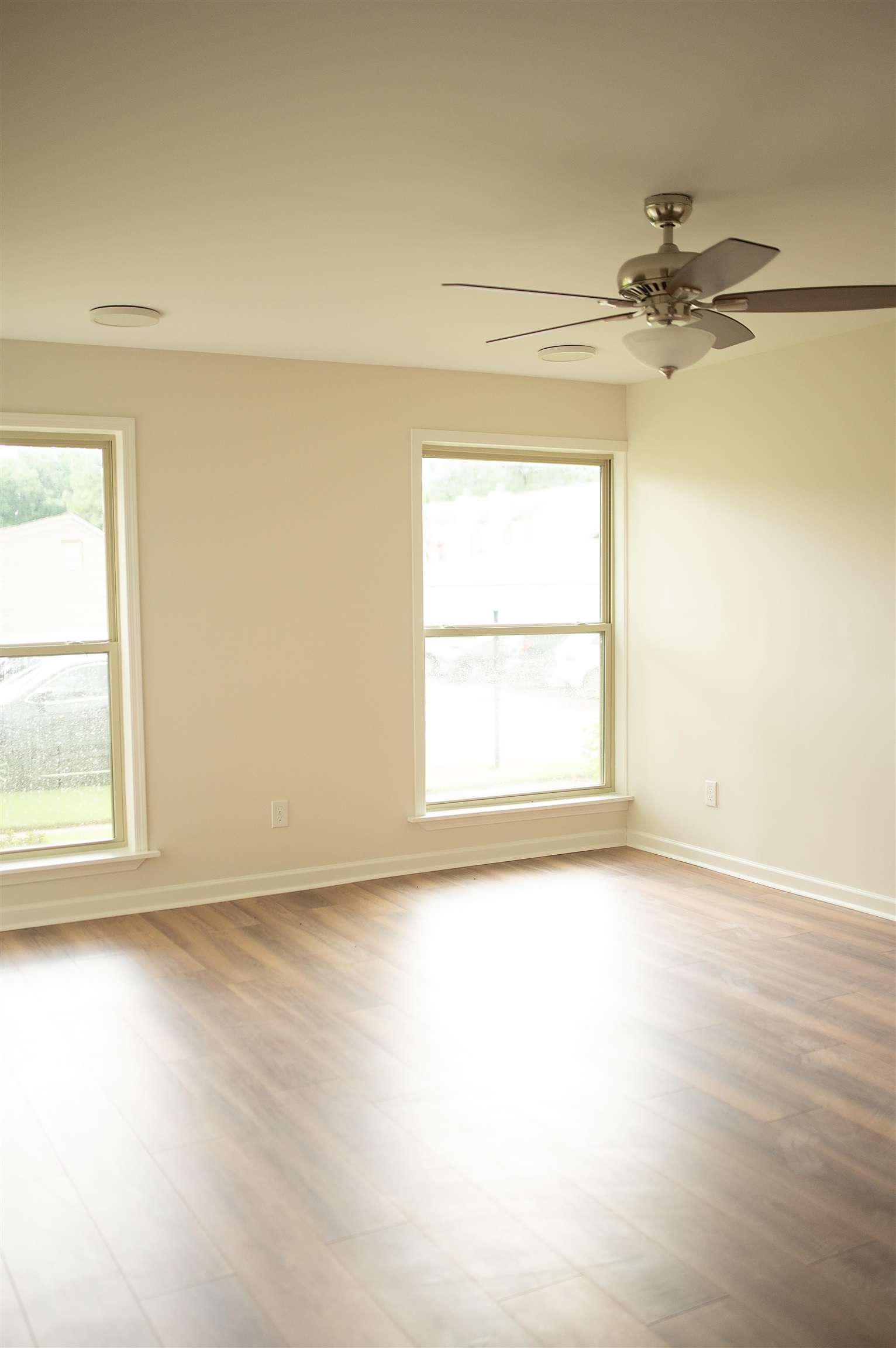 3102 Rising Sun Road, Unit 59 Lakeland, TN 38002 - Photo 3 of 27 Font living room with ceiling fan and light wood-type flooring