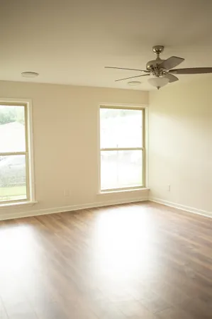 a view of a bathroom with wooden floor
