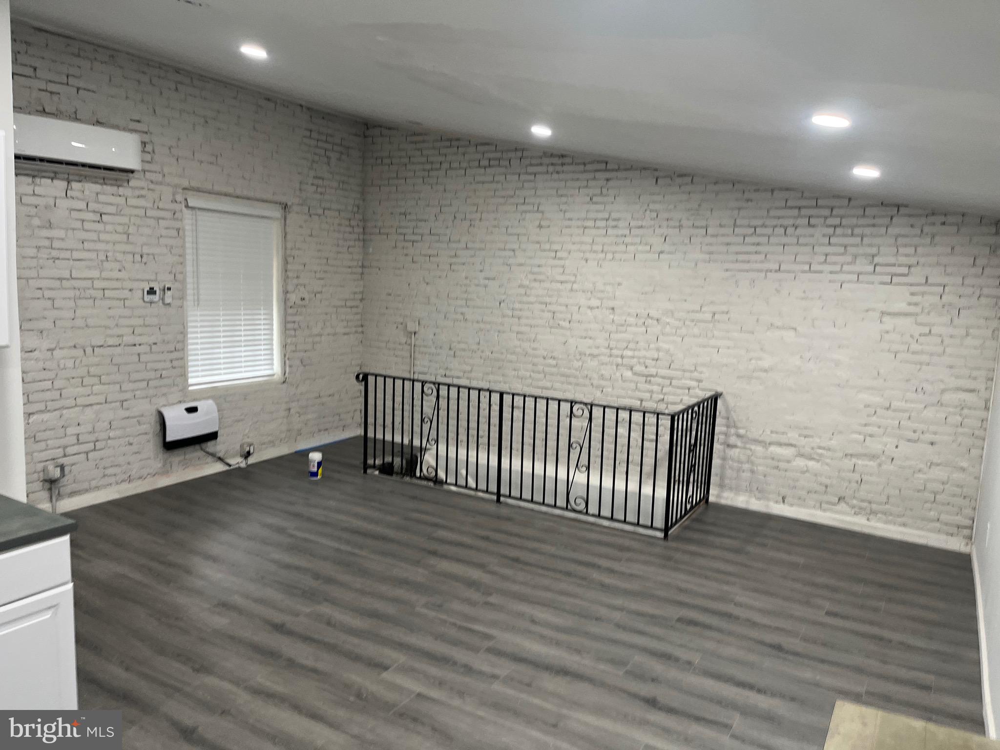 237 Jackson Street, Unit 4 Trenton, NJ 08611 - Photo 3 of 11 a view of a livingroom with wooden floor and chair