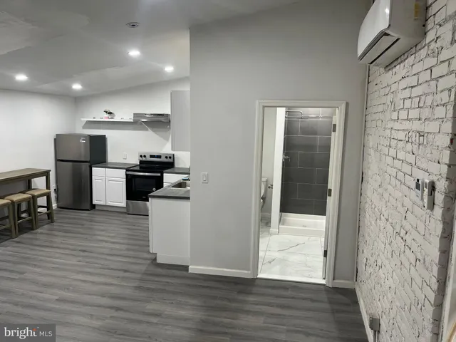a kitchen with stainless steel appliances kitchen island wooden cabinets and granite counter tops