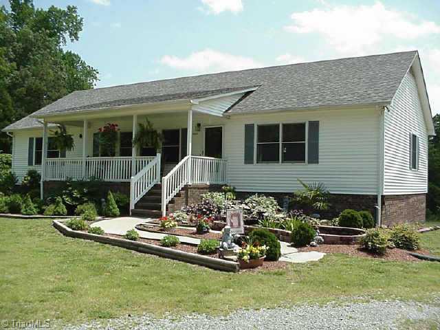 5909 Monnett Road Julian, NC 27283 - Photo 1 of 9 Exterior Front.