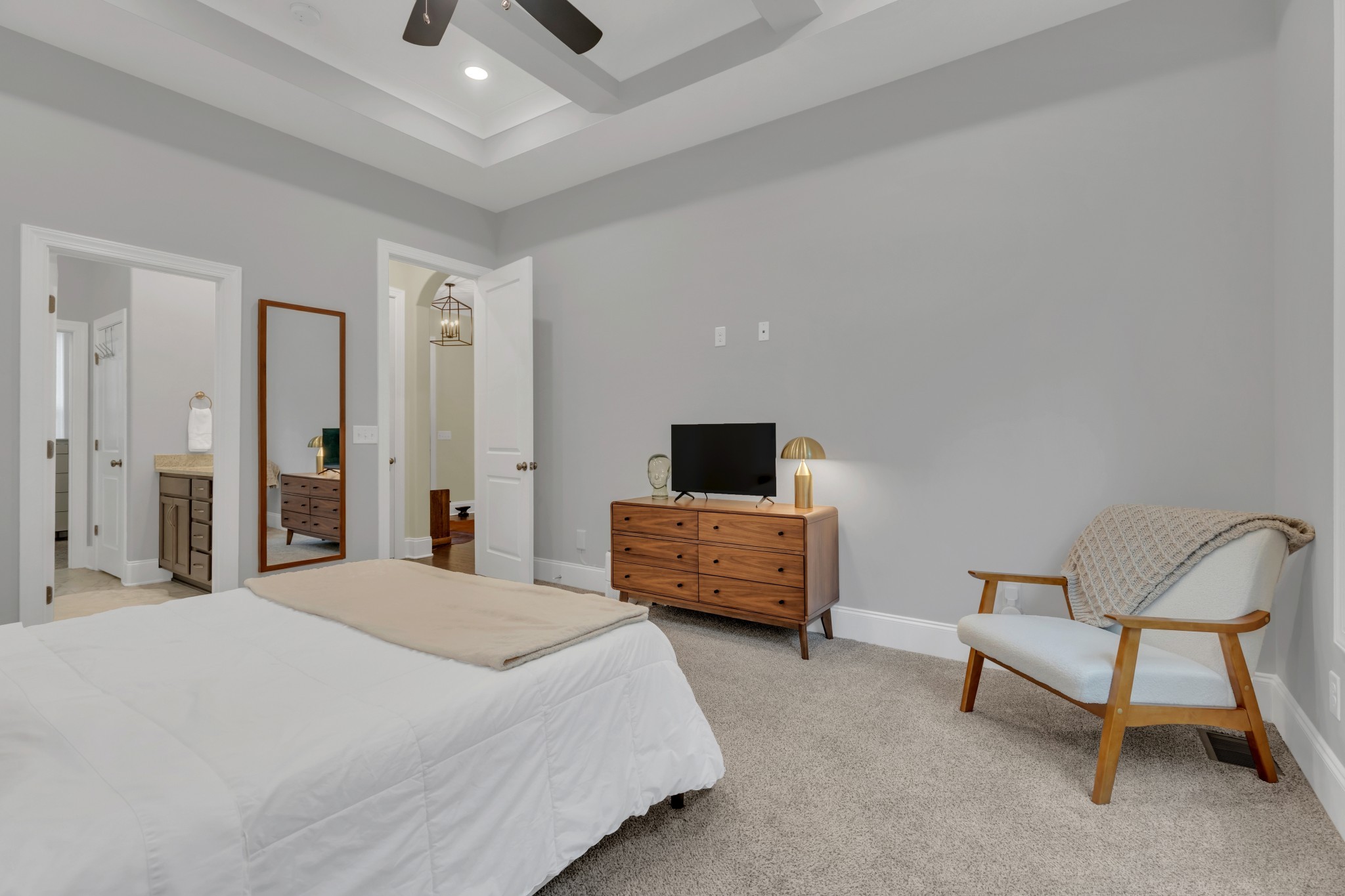 8040 Still Spg Rdg Drive Nashville, TN 37221 - Photo 13 of 38 a bedroom with a bed a chair and a flat screen tv