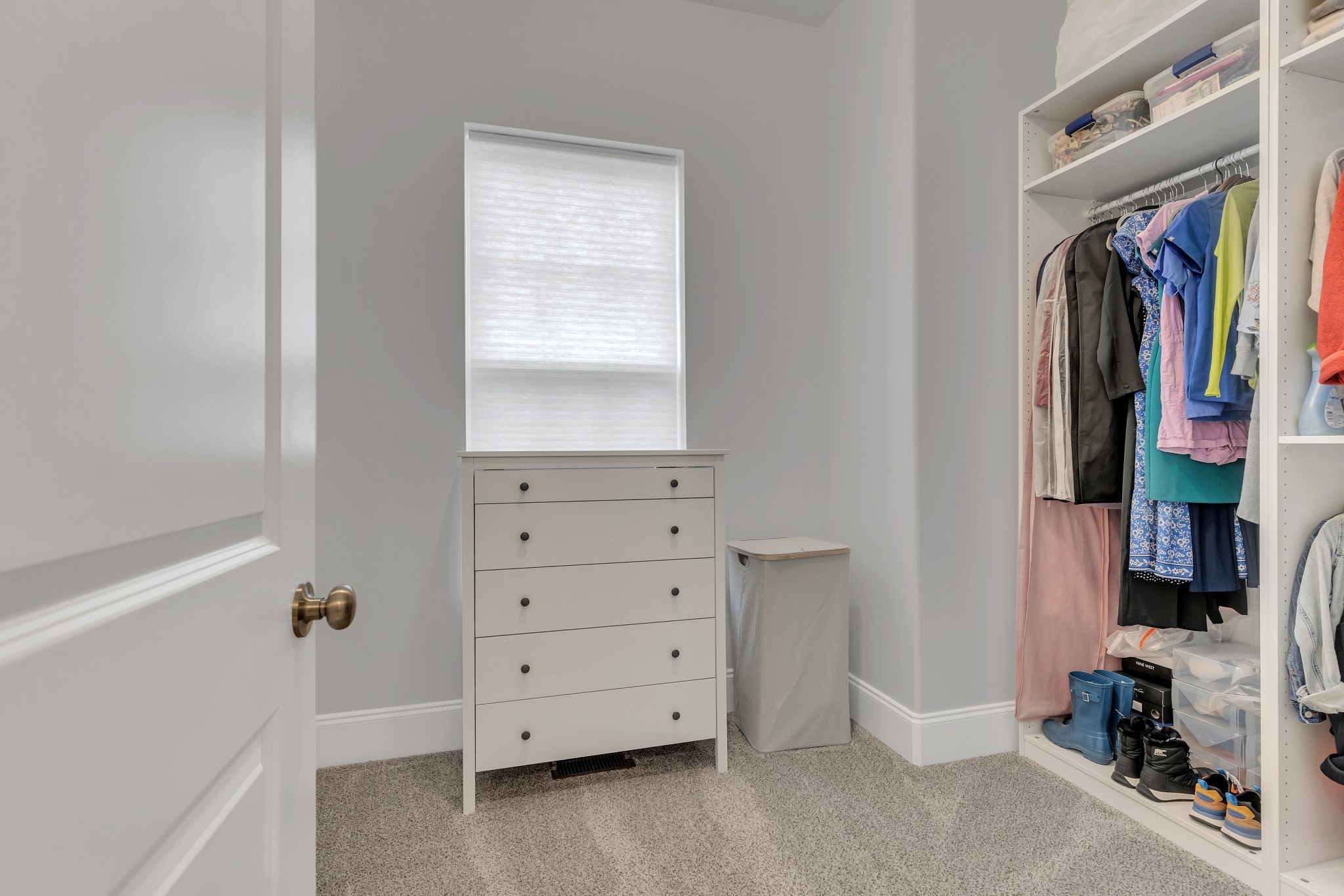 8040 Still Spg Rdg Drive Nashville, TN 37221 - Photo 18 of 38 a view of walk in closet with clothes and shoes