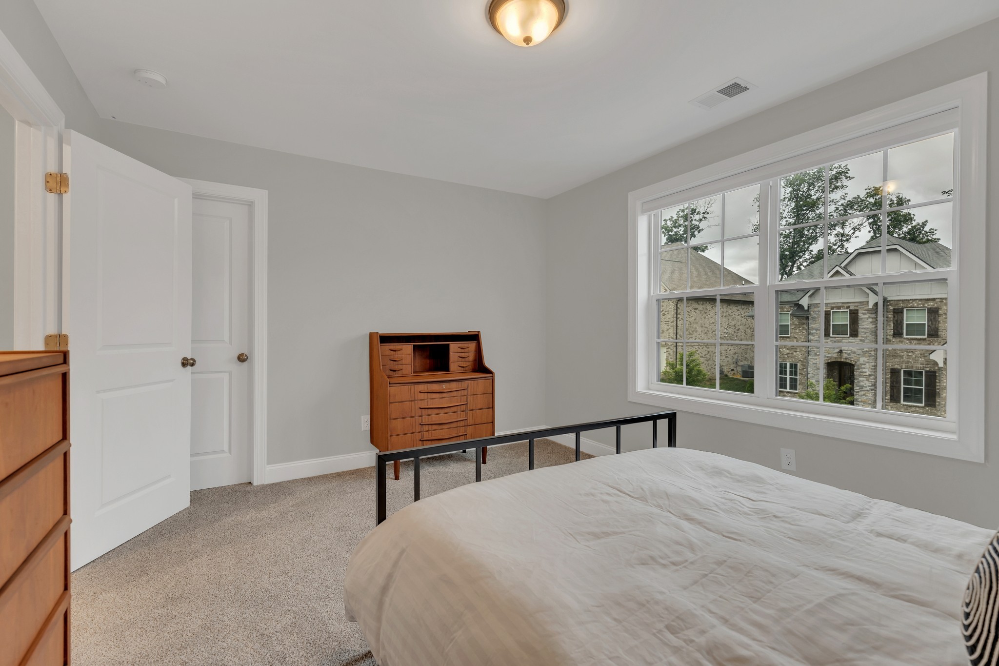 8040 Still Spg Rdg Drive Nashville, TN 37221 - Photo 29 of 38 a bedroom with a bed and a window