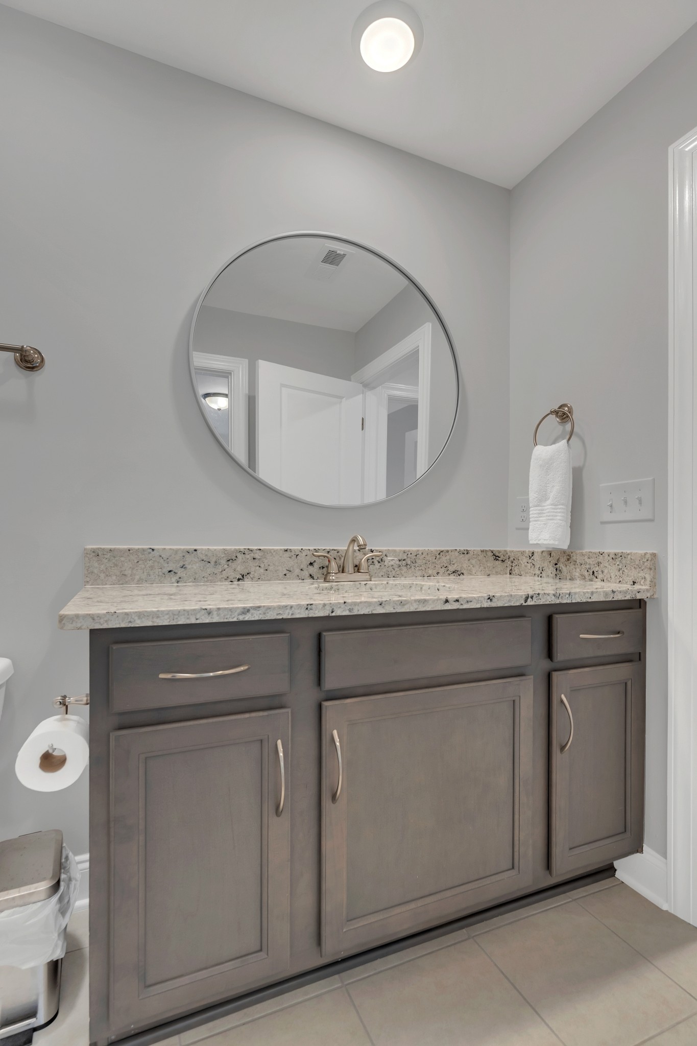 8040 Still Spg Rdg Drive Nashville, TN 37221 - Photo 30 of 38 a bathroom with a granite countertop toilet sink and mirror