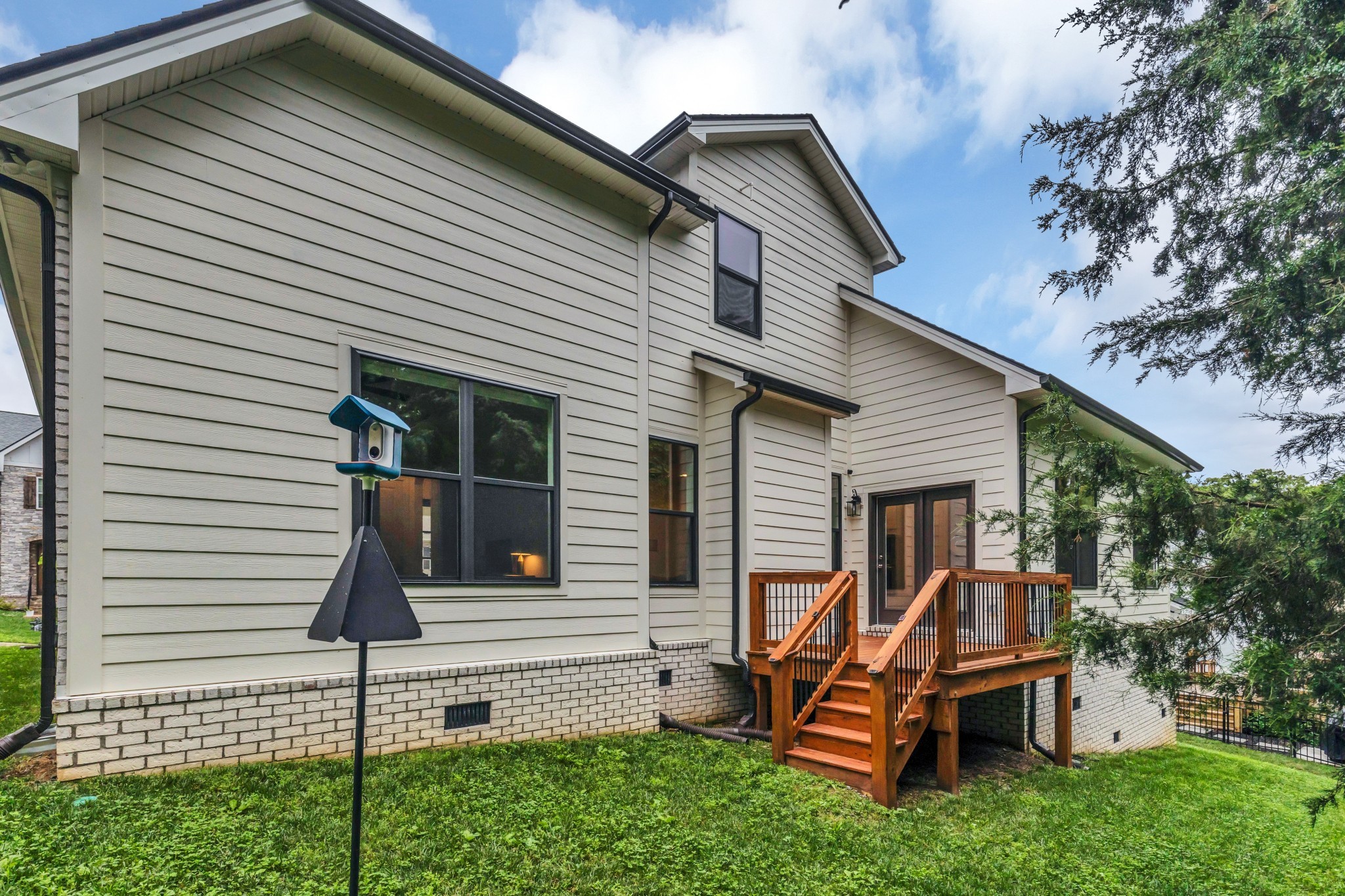 8040 Still Spg Rdg Drive Nashville, TN 37221 - Photo 36 of 38 a view of a house with a small yard and wooden fence