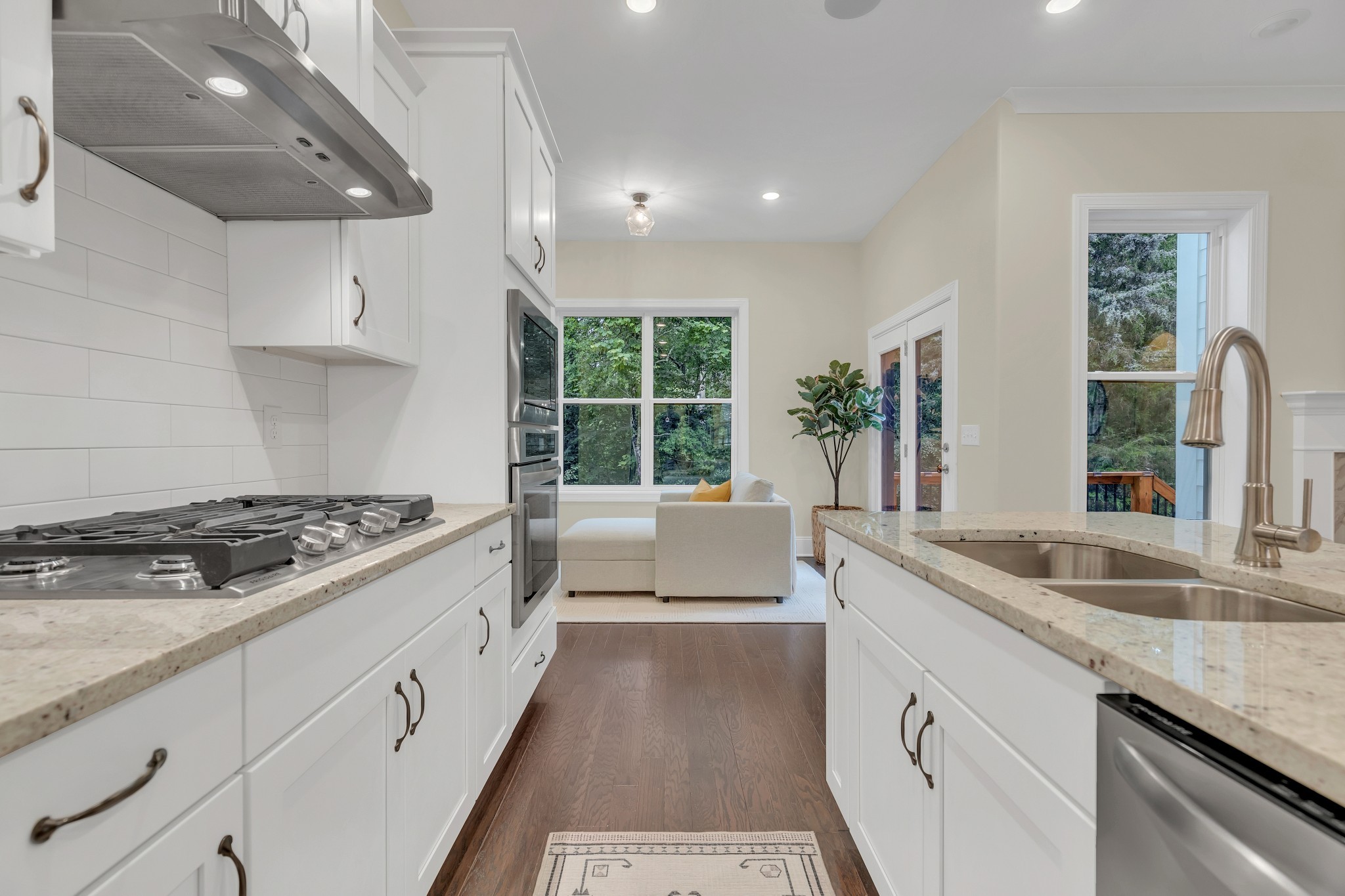 8040 Still Spg Rdg Drive Nashville, TN 37221 - Photo 9 of 38 a kitchen with stainless steel appliances granite countertop a sink stove and cabinets