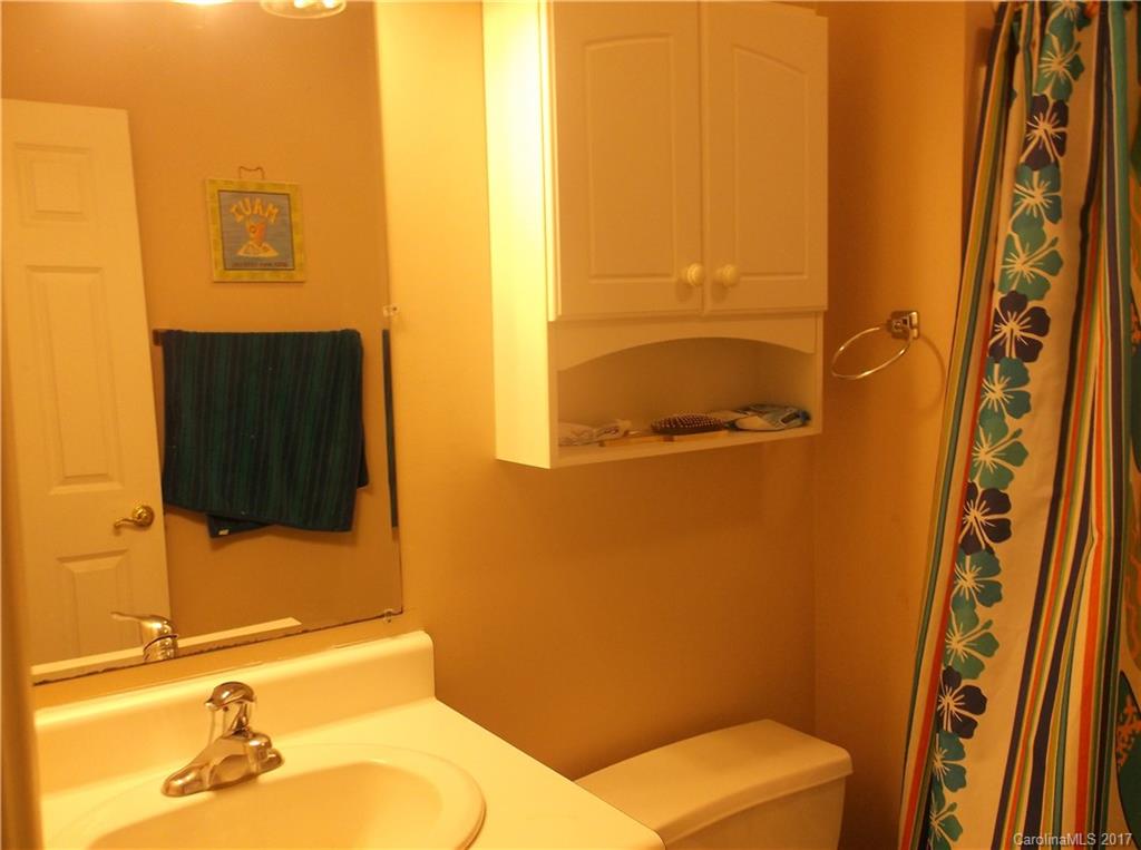 4061 Wycoff Road Sharon, SC 29742 - Photo 15 of 22 a bathroom with a sink and a mirror
