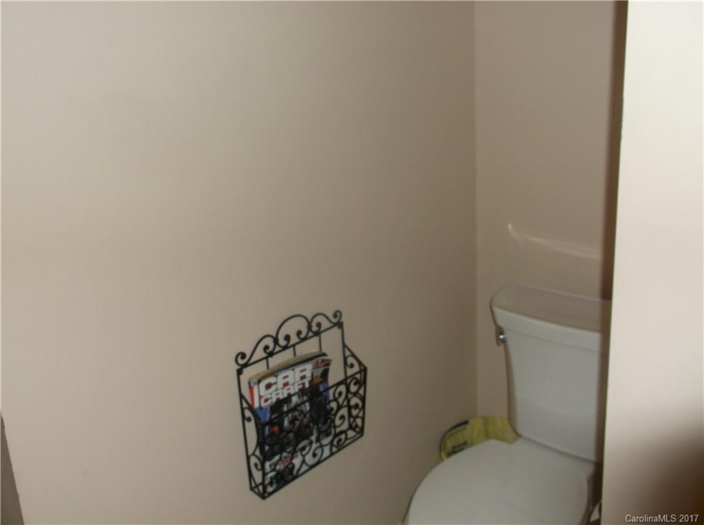 4061 Wycoff Road Sharon, SC 29742 - Photo 21 of 22 a bathroom with a toilet and a shower curtain