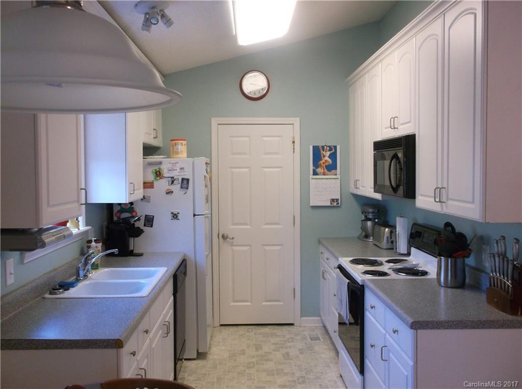 4061 Wycoff Road Sharon, SC 29742 - Photo 9 of 22 a kitchen with cabinets and appliances