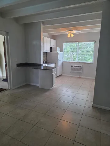 a kitchen with a sink a counter top space and appliances