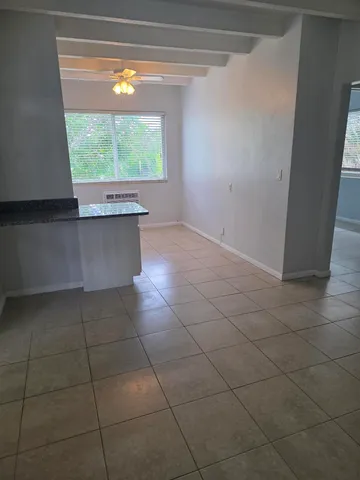 a view of a kitchen with furniture and window