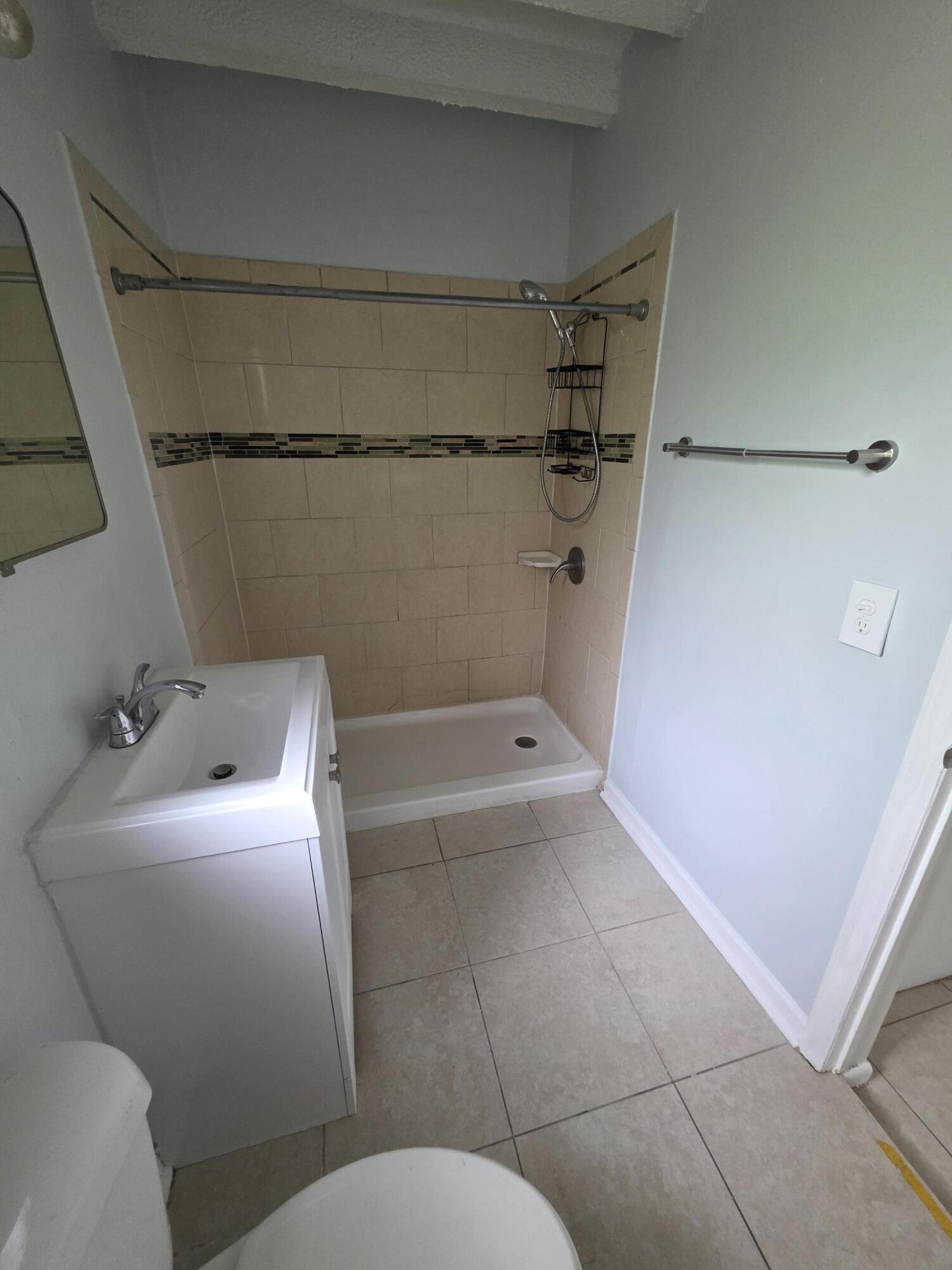 100 Cascade Lane, Unit 9 Palm Beach Shores, FL 33404 - Photo 7 of 7 a bathroom with a sink and toilet