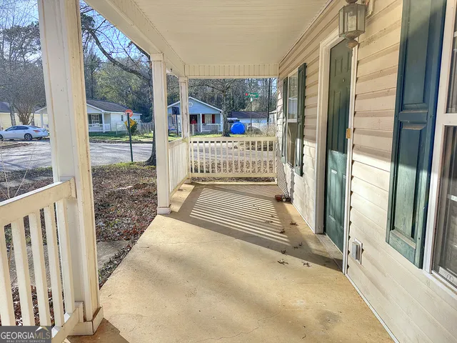 a view of a balcony with wooden floor