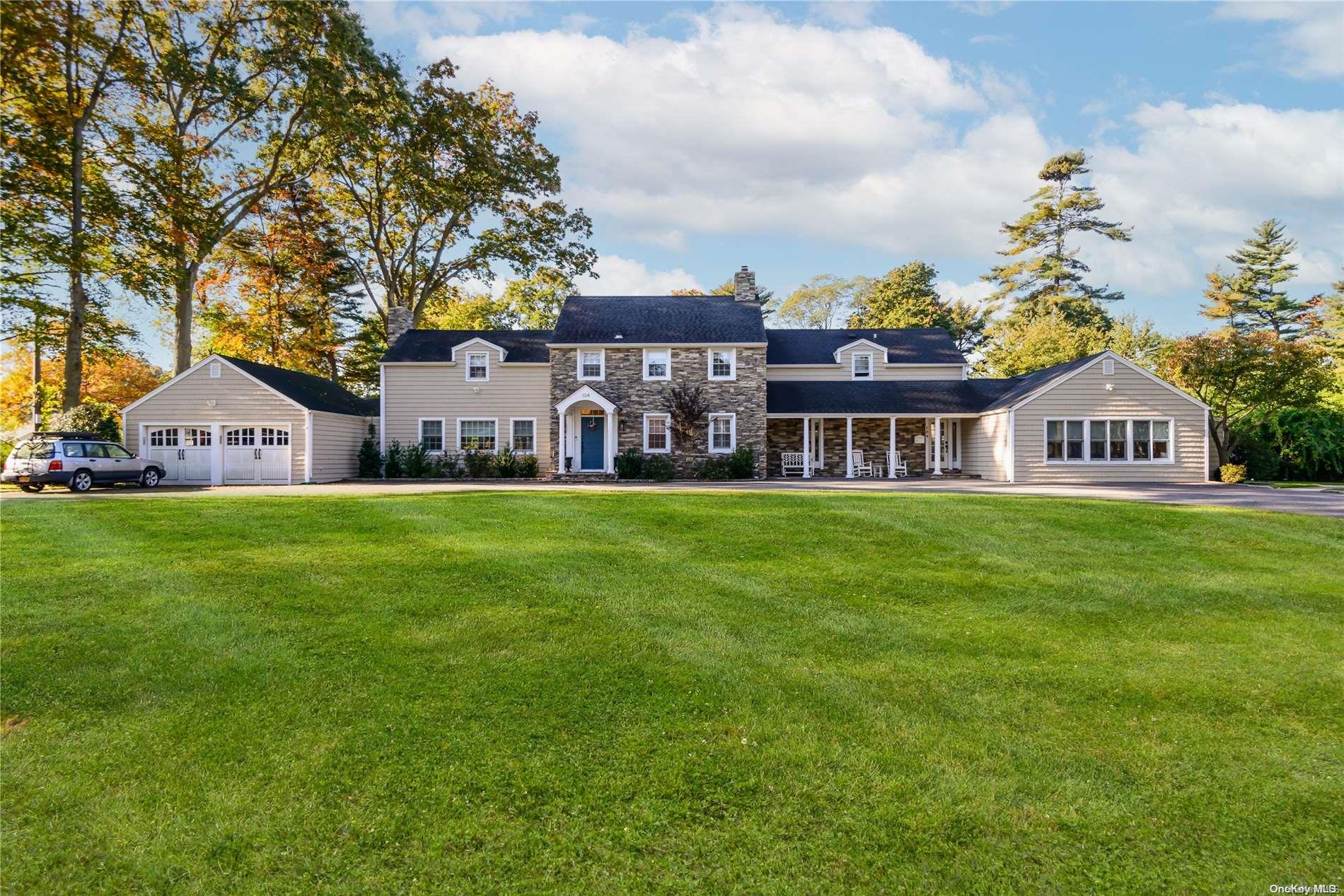 104 Wetherill Road Garden City, NY 11530 - Photo 1 of 1 a front view of house with yard and green space