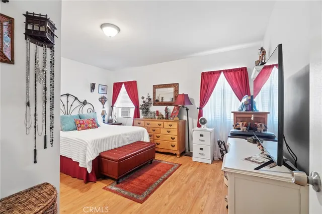 a room with a bed and a tv