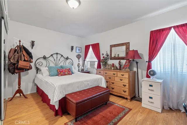 a bedroom with a bed and a dresser