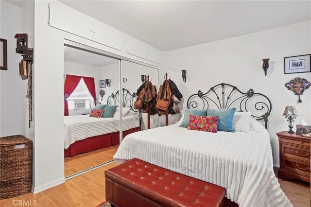 a bedroom with a bed and walk in closet