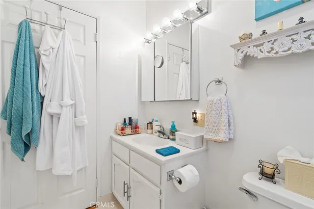 a bathroom with a sink vanity and a mirror