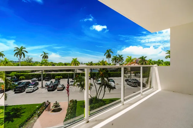 a view of a swimming pool with a table and chairs