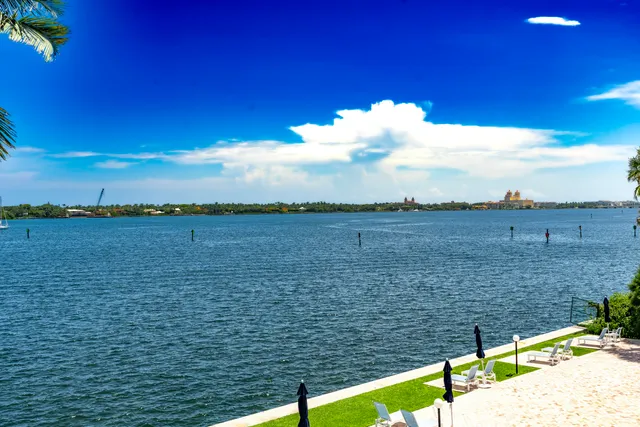 a view of a swimming pool with a table and chairs