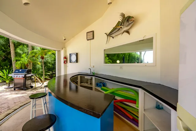 a room with gym equipment and windows