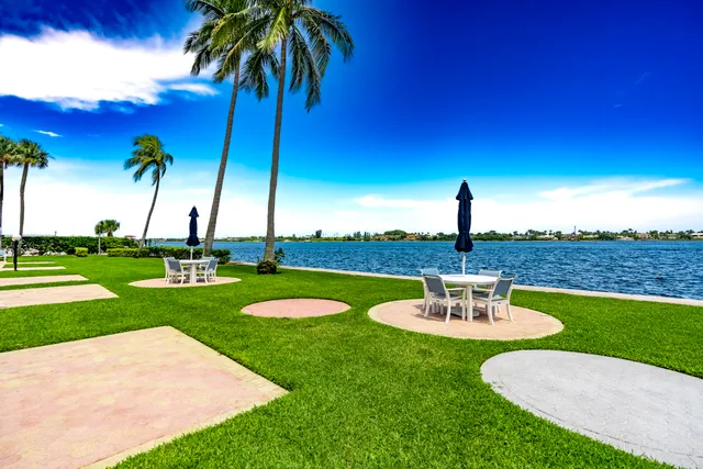 a view of a hallway with potted plants