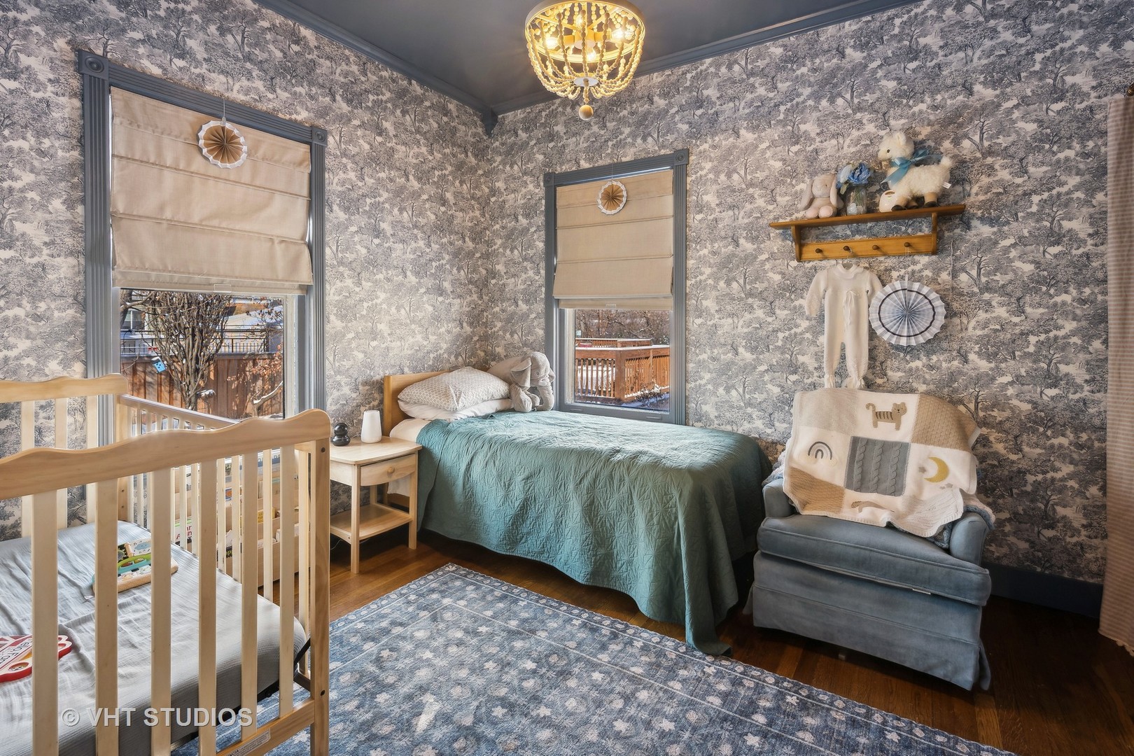 3762 North Harding Avenue Chicago, IL 60618 - Photo 7 of 25 a bedroom with a bed and a chandelier