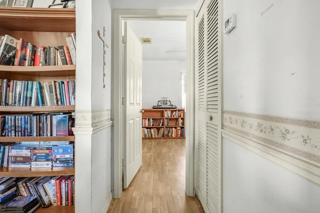 a view of a book shelf with lots of books