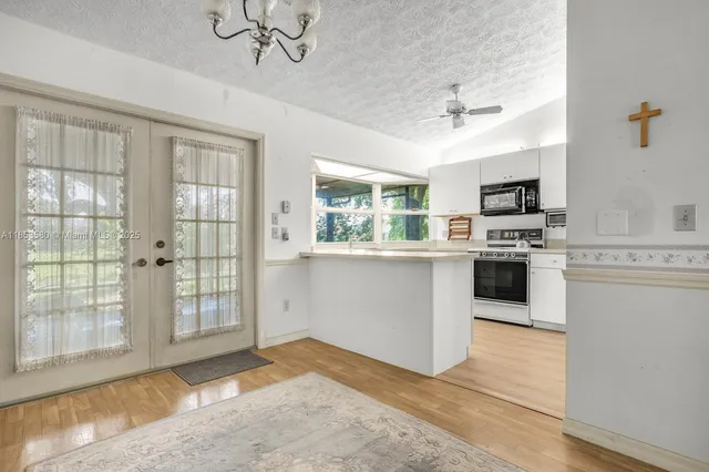 a kitchen with a stove a sink and a refrigerator