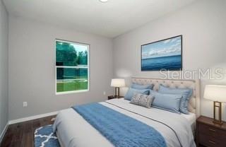 10095 Southwest 44th Terrace Ocala, FL 34476 - Photo 12 of 12 a bedroom with a bed and a window