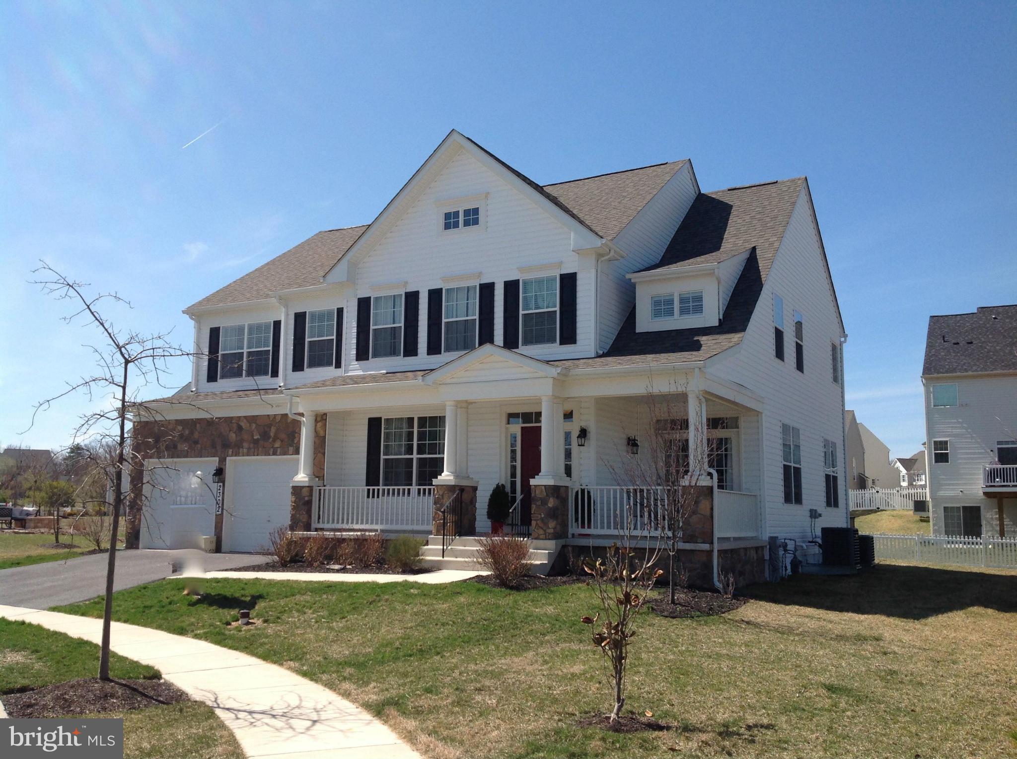 2302 Winterwood Road Baltimore, MD 21209 - Photo 1 of 30 a front view of a house with a yard