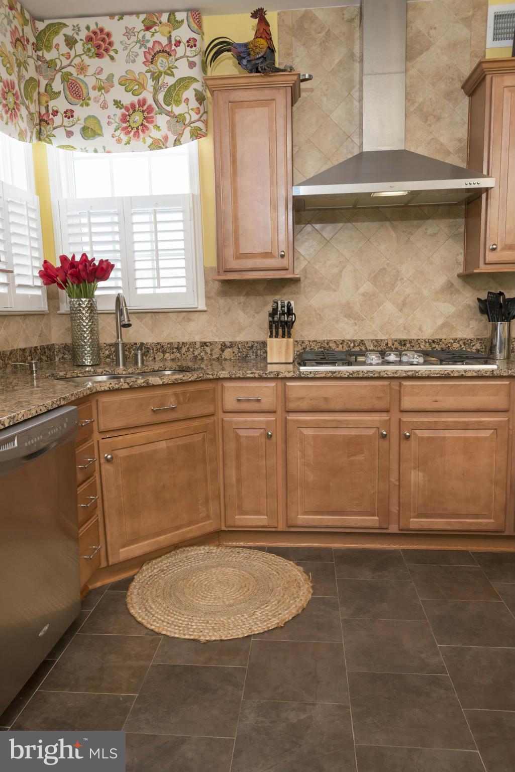 2302 Winterwood Road Baltimore, MD 21209 - Photo 14 of 30 a bathroom with a sink a stove and cabinets