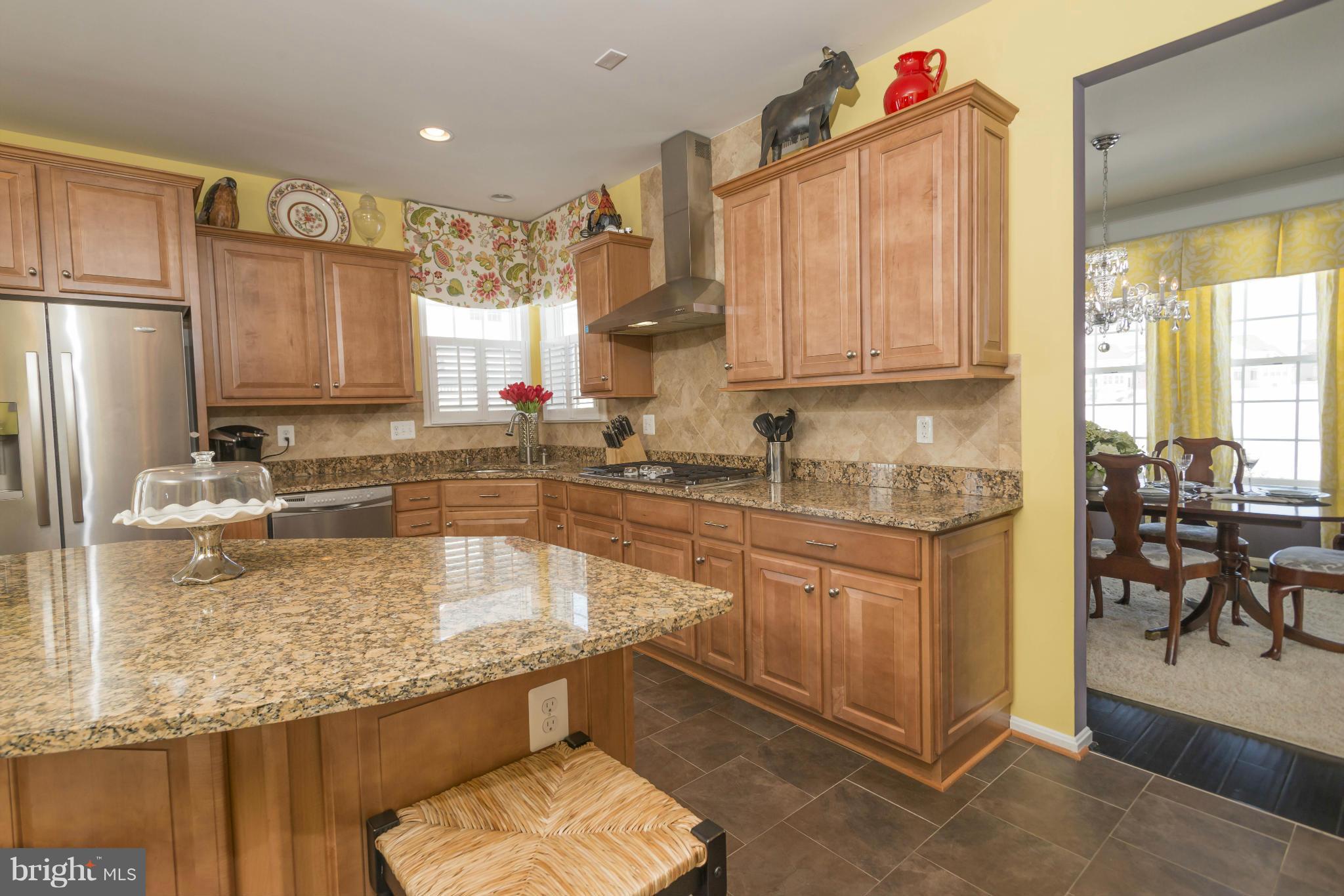 2302 Winterwood Road Baltimore, MD 21209 - Photo 15 of 30 a kitchen with granite countertop a sink stove and refrigerator