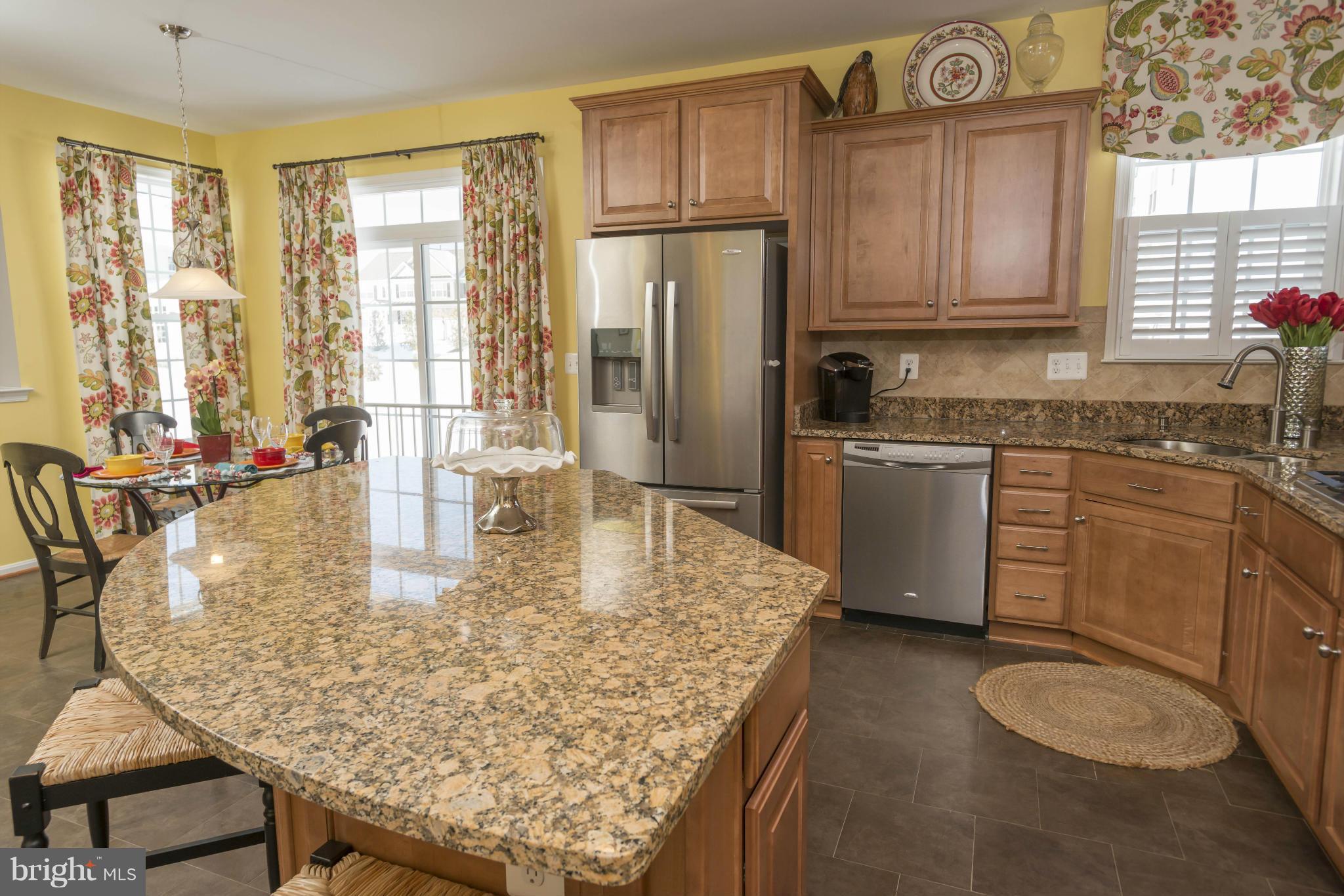 2302 Winterwood Road Baltimore, MD 21209 - Photo 16 of 30 a kitchen with stainless steel appliances granite countertop a sink a stove and refrigerator