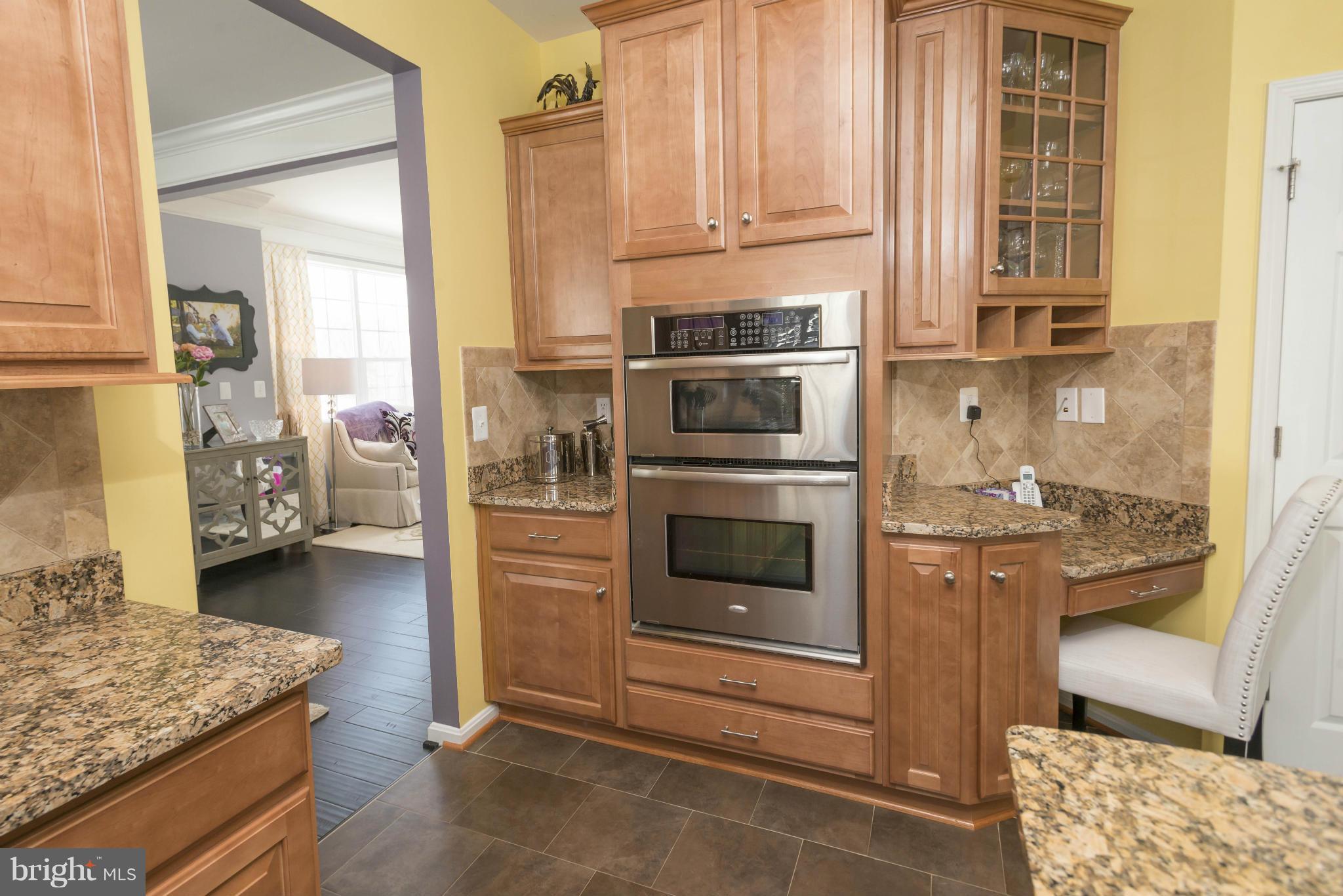 2302 Winterwood Road Baltimore, MD 21209 - Photo 17 of 30 a kitchen with a stove and a refrigerator