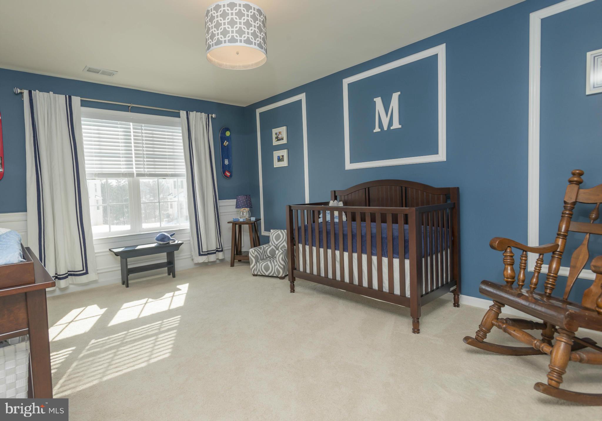 2302 Winterwood Road Baltimore, MD 21209 - Photo 19 of 30 a bedroom with a bed and a window
