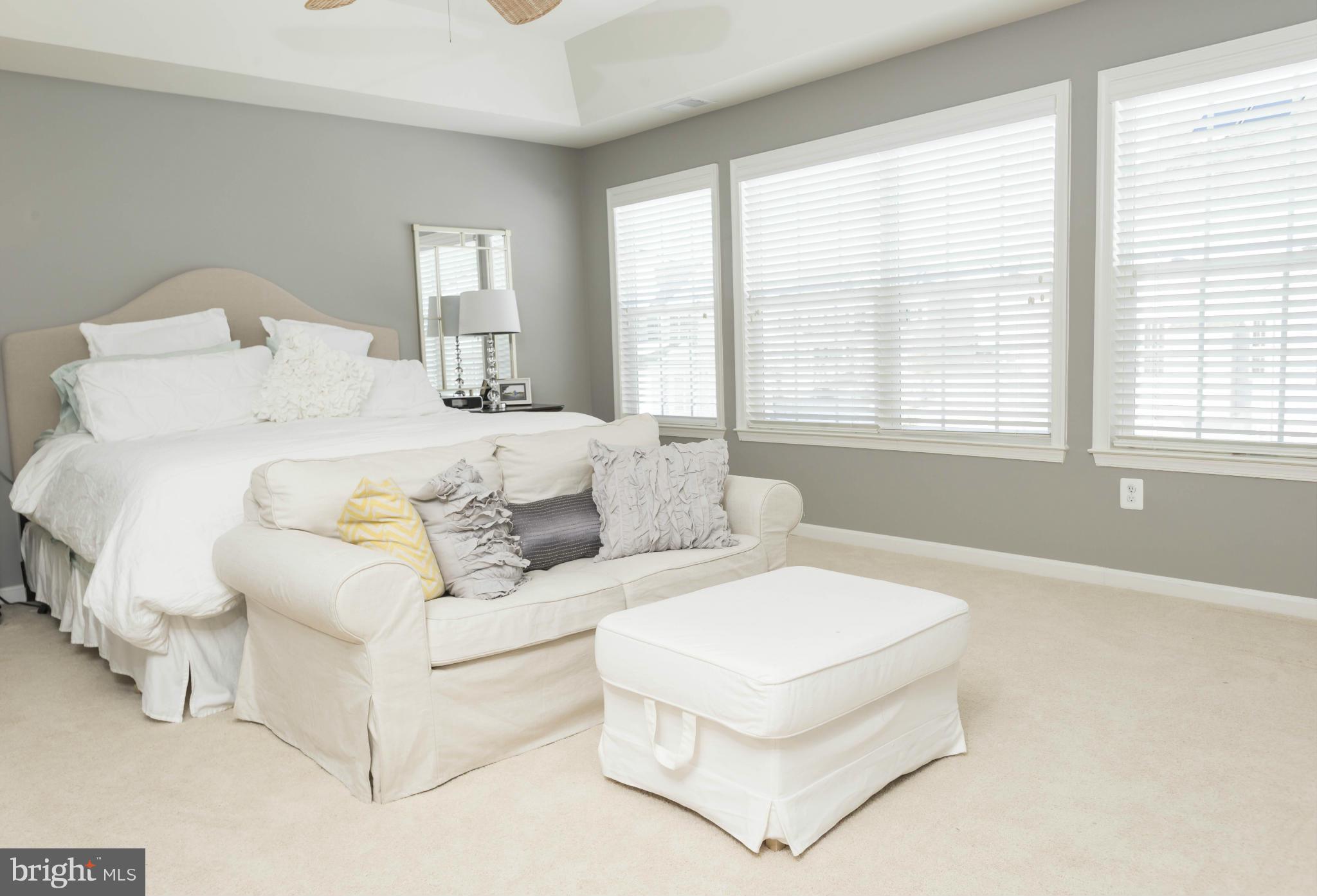 2302 Winterwood Road Baltimore, MD 21209 - Photo 20 of 30 a spacious bedroom with a bed and a large window