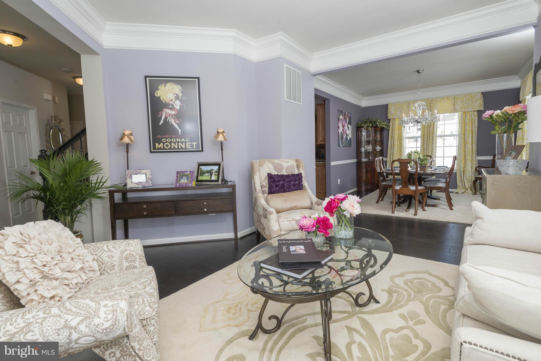 2302 Winterwood Road Baltimore, MD 21209 - Photo 3 of 30 a living room with furniture and a potted plant