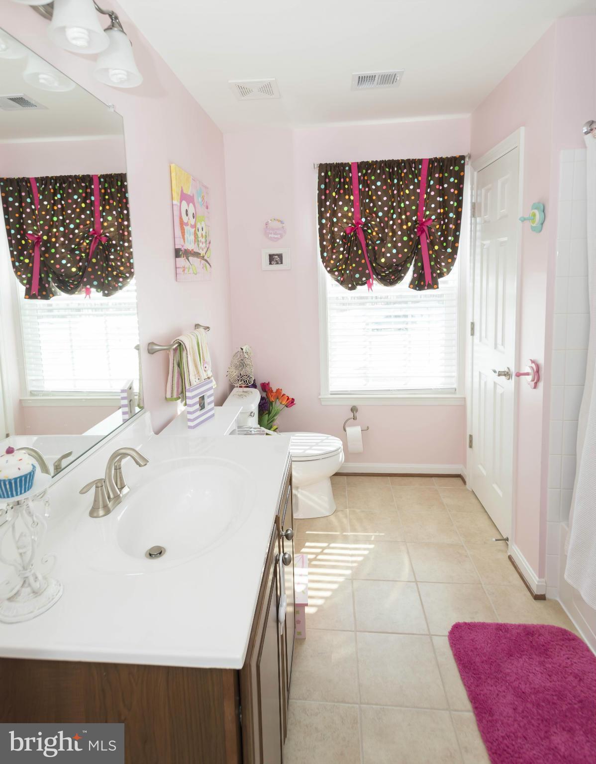 2302 Winterwood Road Baltimore, MD 21209 - Photo 26 of 30 a bathroom with a sink and a mirror