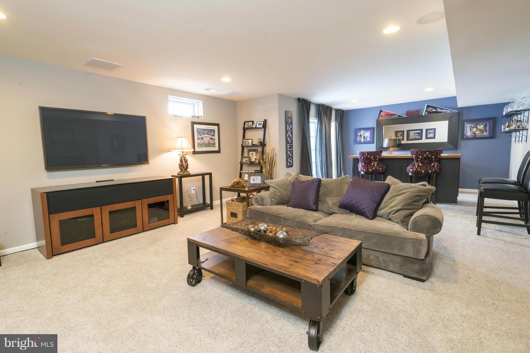 2302 Winterwood Road Baltimore, MD 21209 - Photo 29 of 30 a living room with furniture and a flat screen tv